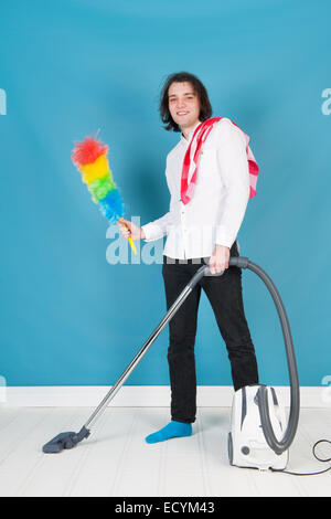 man with vacuum cleaner and other equipment Stock Photo