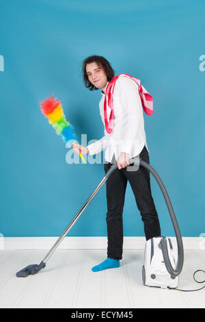 man with vacuum cleaner and other equipment Stock Photo