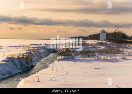 Range light or lighthouse on a frozen waterfront in Summerside, Prince Edward Island. Stock Photo