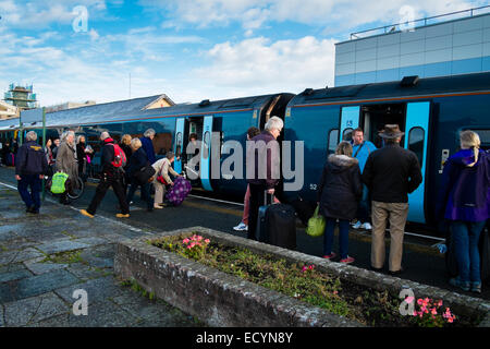 Passengers travelers on the platform boarding an Arriva Trains Wales train at Aberystwyth railway station, Wales UK Stock Photo