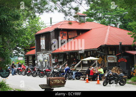 Motorcycle riders enjoy a rest stop at Rabbit Hash, Kentucky, USA. Circa 1813. A historic small town on the Ohio River. Added to Stock Photo