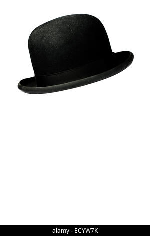 A derby hat, also referred to as a bowler hat suspended on a white background. Stock Photo