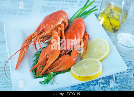 boiled crawfish with fresh lemon on the plate Stock Photo
