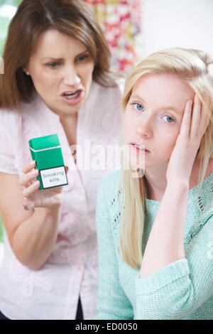 Mother Confronting Daughter Over Dangers Of Smoking Stock Photo