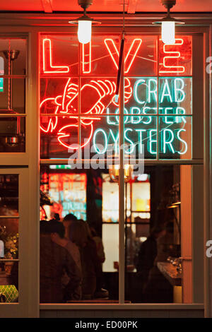 Live Crab Lobster Oysters sign at the Old Spitalfields Market Stock Photo