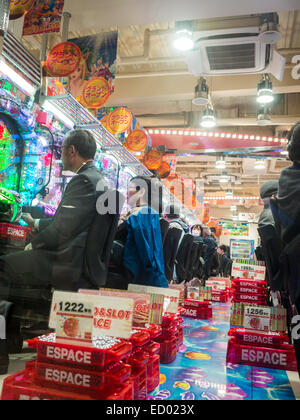 Playing pachinko Stock Photo