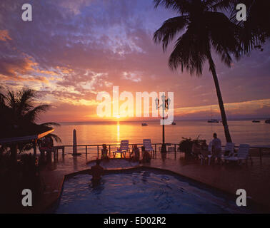 Swimming pool at sunset, Couples Negril Resort, Negril Beach, Negril, Westmoreland Parish, Jamaica, Greater Antilles, Caribbean Stock Photo