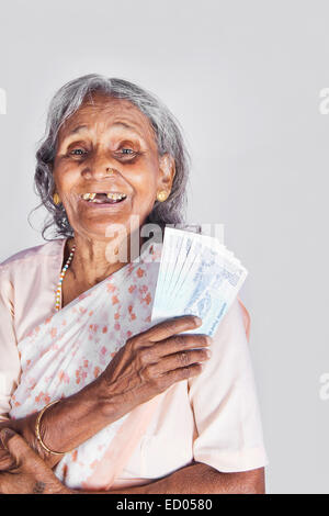 1 indian Old Senior Woman Saving money Stock Photo