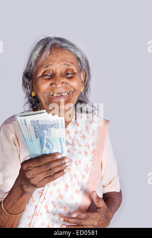 1 indian Old Senior Woman Saving money Stock Photo