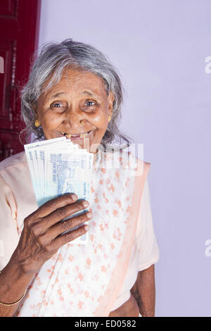 1 indian Old Senior Woman Saving money Stock Photo