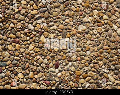 exposed aggregate concrete with rounded pebbles background texture Stock Photo