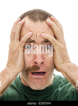 man shocked to see he has only half his mustache with his hands on his head and white background Stock Photo