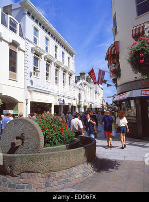 Traditional apple crusher planter on King Street (Rue de Derrière), St Helier, Jersey, Channel Islands Stock Photo