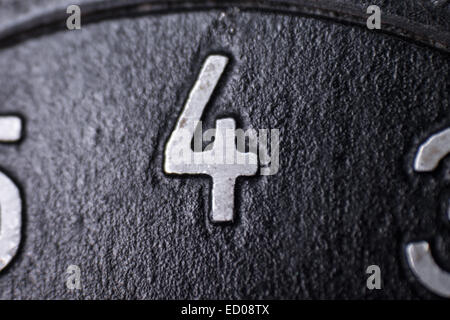 number four on an old metallic surface Stock Photo