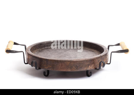 Empty round clay tray on metal grid. Stock Photo