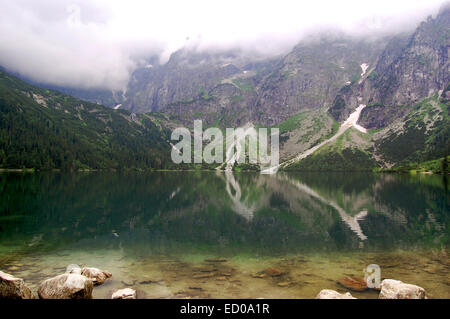 Rest and fishing in nature. A picturesque place on the lake. An inflatable  boat on the shore of a Soodla Reservoir Stock Photo - Alamy