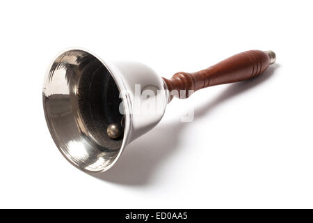 School bell with wooden handle isolated on white background. Stock Photo