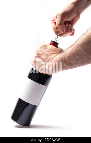 Man is opening a bottle of wine isolated on white background. Stock Photo