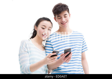 Happy young couple using smart phone Stock Photo
