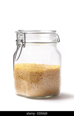 Photo of couscous into a jar isolated on white. Stock Photo