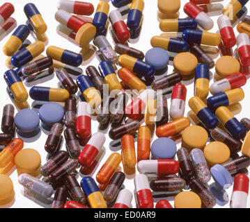 Assorted Pills capsules and tablets on glass background Stock Photo