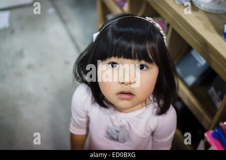Portrait of girl wearing pink headband Stock Photo
