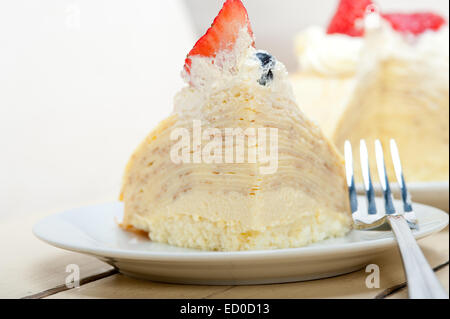 crepe pancake cake with whipped cream and strawberry on top Stock Photo