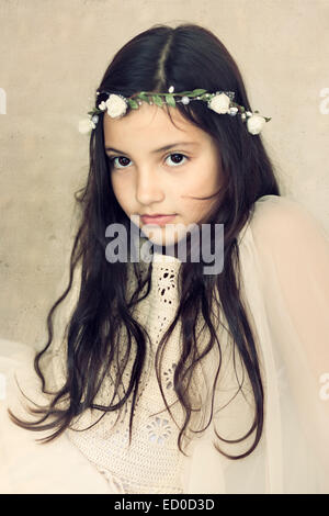 Little girl (6-7) portrait in white Stock Photo