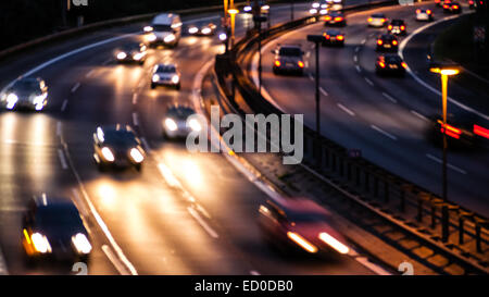 car lights on highway by night Stock Photo