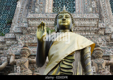 Buddha statue in front of  prang Wat Arun, The Temple of Dawn, Bangkok, Thailand. Buddhist temple. Thonburi. Stock Photo