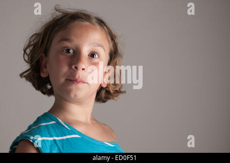 Girl (6-7) making faces Stock Photo