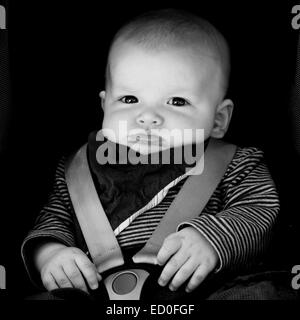 Little baby boy (2-5 months) sitting in car seat Stock Photo