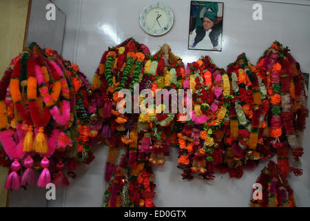 Srinagar, Indian Administered Kashmir: 23 December garlands hanging on the wall backdrop file picture patron mufti mohammad syed at party head quarter after winning their 28 seats counting for all the 87 assembly seats in Jammu and Kashmir state began  Credit: Sofi Suhail/Alamy Live News ) Stock Photo