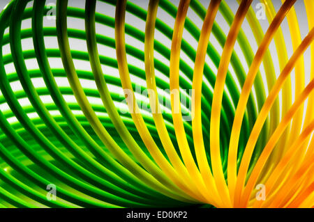 Rainbow colored wire spiral abstract background Stock Photo