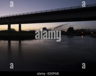 Bridge carrying Newark bypass over the river Trent seen at dusk with the sugar factory in the background Stock Photo