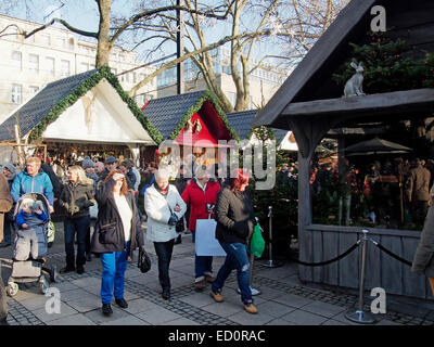 Christmas markets are always popular in Germany with locals and tourists as here in the Markt der Engel in Neumarkt in Cologne. Stock Photo