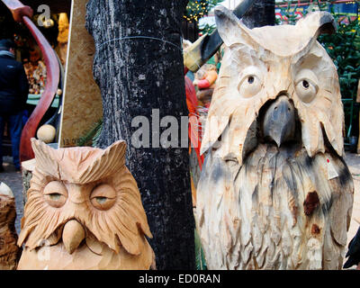 Carved wooded owls in the Home of the Elves (Heimat der Heinzel)  Christmas Market in  the Altermarkt, Cologne, Germany Stock Photo