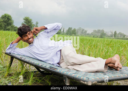 1 indian rural farmer Field talking phone Stock Photo