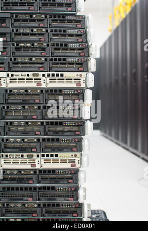 Stack of servers. Multiple servers on top of each other in a datacenter. Stock Photo