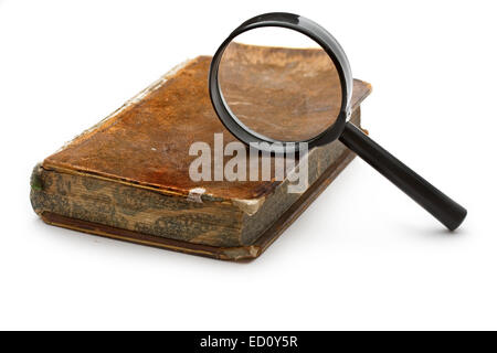 Magnifying glass and old book isolated on white Stock Photo