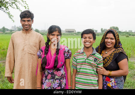 indian rural  Parents and children standing farm Stock Photo
