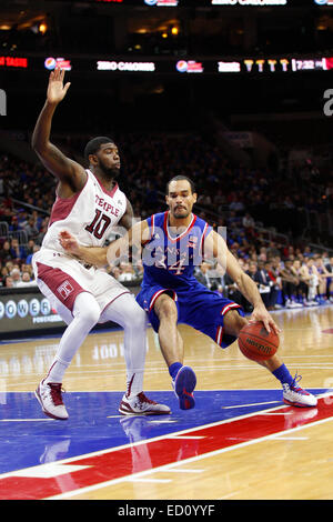 December 22, 2014: Kansas Jayhawks forward Perry Ellis (34) in action against Temple Owls forward Mark Williams (10) during the NCAA basketball game between the Kansas Jayhawks and the Temple Owls at the Wells Fargo Center in Philadelphia, Pennsylvania. The Temple Owls won 77-52. Stock Photo