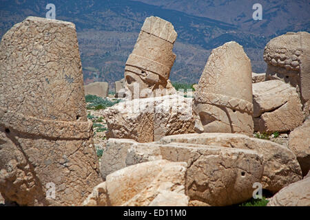 Broken stone heads at Mount Nemrut / Nemrud / Nemrut Dagi, royal tomb from the 1st century BC in Adıyaman, southeastern Turkey Stock Photo