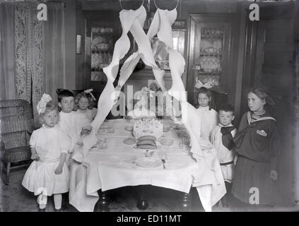 Antique, circa 1911 image, Victorian birthday party for a 6- or 7-year-old girl in Jamaica Plain, Boston, Massachusetts, USA. Stock Photo