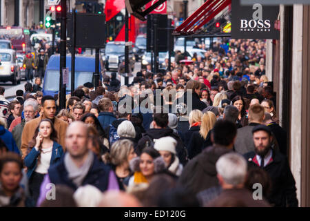 London, UK. 23rd Dec, 2014. Dubbed by retailers as the 'Golden Hour' thousands of shoppers use their lunch hour to do some last minute Christmas shopping in London's West End. PICTURED: Thousands of shoppers cram up-market Regent Street. Credit:  Paul Davey/Alamy Live News Stock Photo