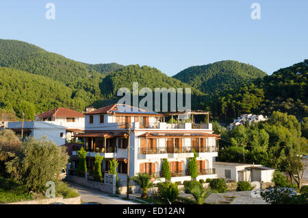 Accommodation blocks in the resort of Elios, Skopelos, Greece. October. Surrounded by Aleppo Pine [Pinus halepensis] Stock Photo