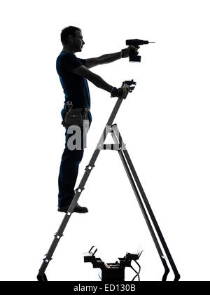 one manual worker man standing on ladder drilling in silhouette on white background Stock Photo