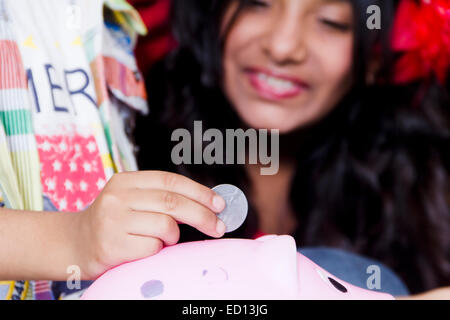 2 children Piggy Bank saving money Stock Photo