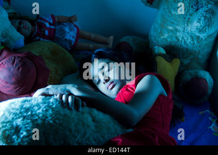 1 indian child  girl Sleeping  Bedroom Stock Photo