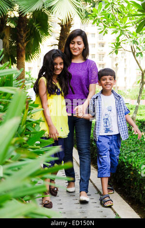 indian mother with children  park walking Stock Photo